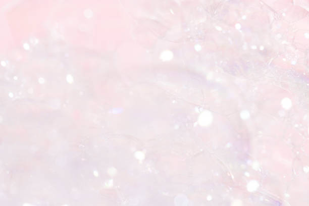 Soap foam, bubbles close-up on a pink background