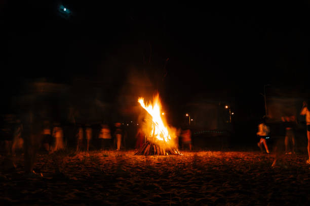 istock The crowd gathered around the bonfire for a gathering 2204476957