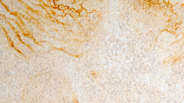 istock Dirty old tile with yellow brown stain. 2204481379