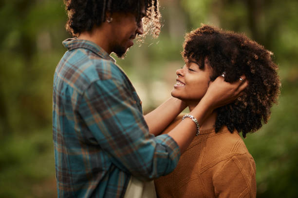 istock Affectionate African American couple enjoying a day at the park. 2204483771
