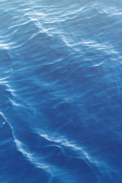 istock Sea surface. Blue water texture. Close up blue water surface at deep ocean. 2204484142