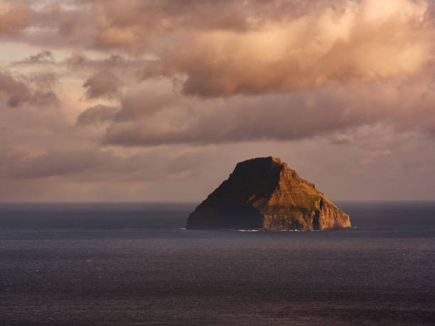 istock Stack rock in the middle of the Atlantic ocean at sunset. 2204485438