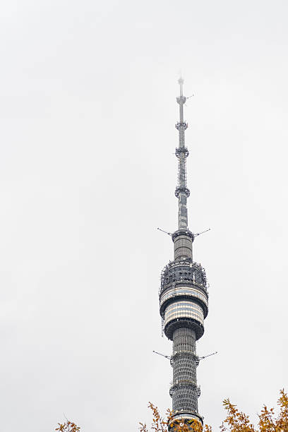 istock Cloudy day view of a towering communication structure in an urban setting 2204486665
