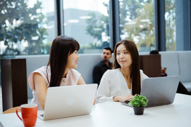 istock Two businesswomen working with laptop in office 2204487677
