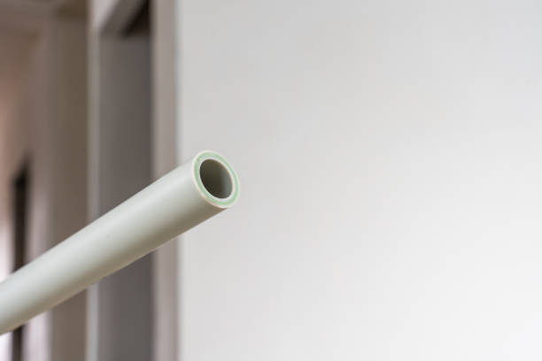 istock White PVC pipe extending in an unfinished room 2204488098