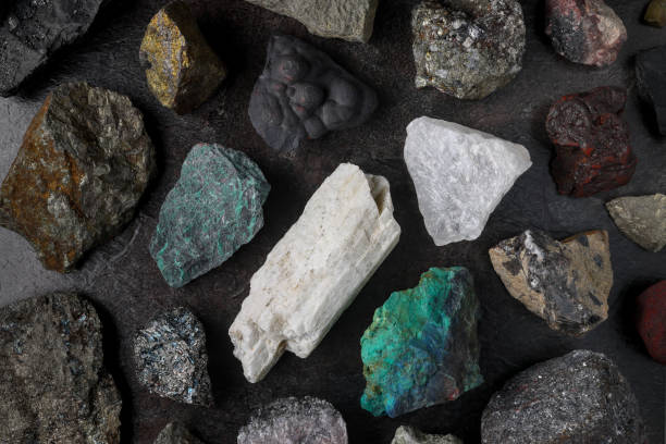 Mixture of critical minerals (United States of America definition), or critical raw materials (European Union definition). Flatlay on slate background
