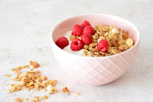 istock Yogurt bowl with granola and fresh raspberries 2204491039