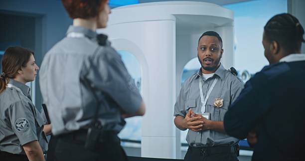 istock TSA Officer Holding Briefing, Providing Instruction to Team of Workers About Screening Procedures 2204491101