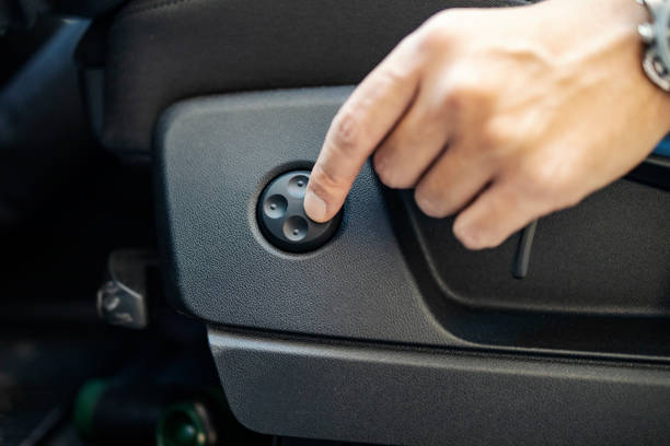 istock Close up of hand pushing seat button in a car. 2204491202