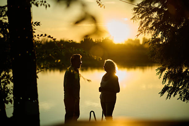 A stunning silhouette depicting children at sunset, perfectly capturing a touching moment