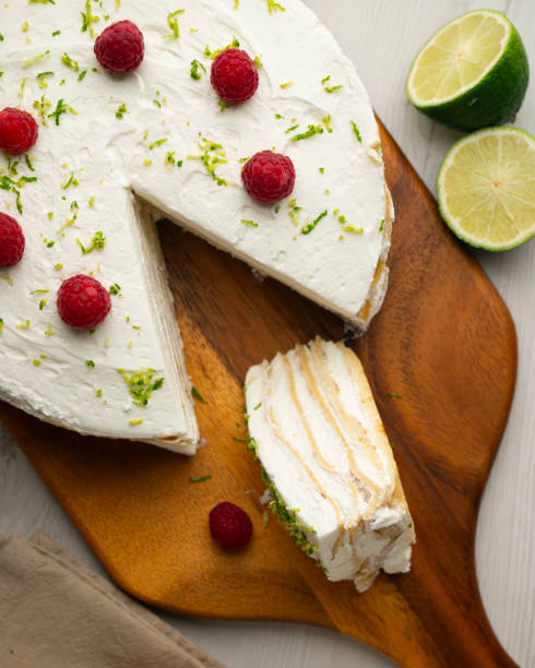 istock Crepe and cream cake decorated with lime and raspberries. 2204494220