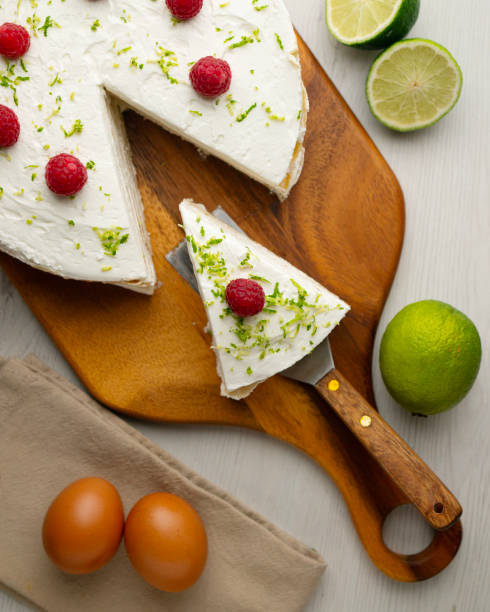 istock Crepe and cream cake decorated with lime and raspberries. 2204494222