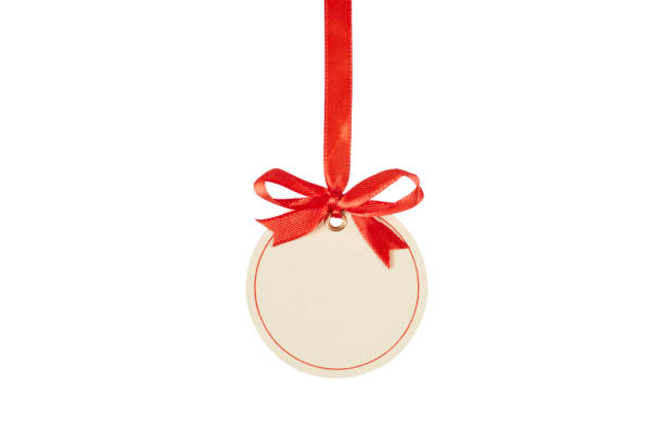 istock christmas gift tag with red bow isolated on white 2204495072