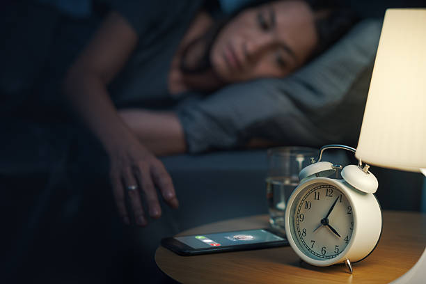 istock Woman receiving a phone call at night 2204495433