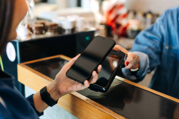 istock Contactless Payment with Smartphone at Cafe Checkout 2204497383