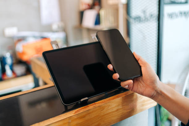 istock Contactless Payment with Smartphone and Tablet at Checkout 2204497402
