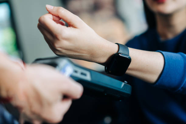 istock Happy Customer Using Smartwatch for NFC Payment at Restaurant 2204497488