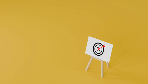 istock standing board and target symbol on yellow background business target concept. 2204497675