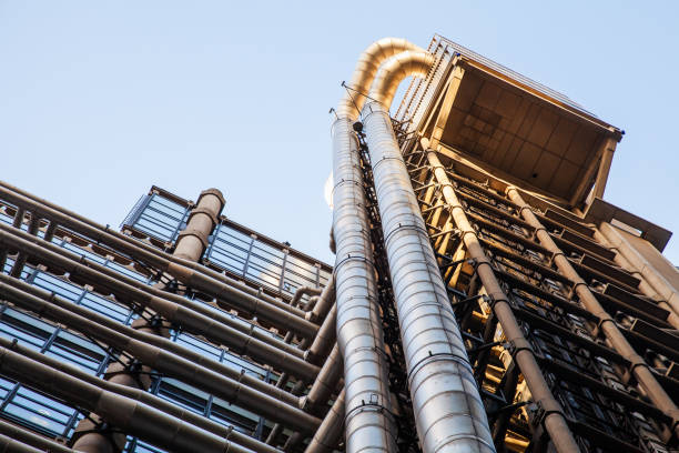 istock A low-angle view of a modern building emphasizing its exterior pipework 2204500059