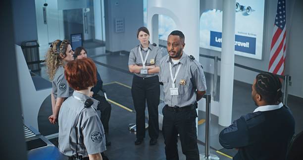 istock TSA Officer Holding Briefing, Providing Instruction to Team of Workers About Scanning Procedures 2204500672