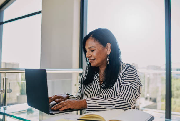 istock Confident Professional Woman Working on Laptop 2204501337