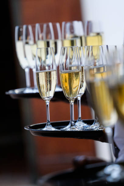 istock Champagne Glasses Arranged Neatly on a Tray at a Formal Event 2204501626