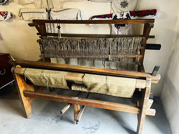 istock Traditional wooden loom with fabric in a rustic setting showcasing cultural heritage 2204502513