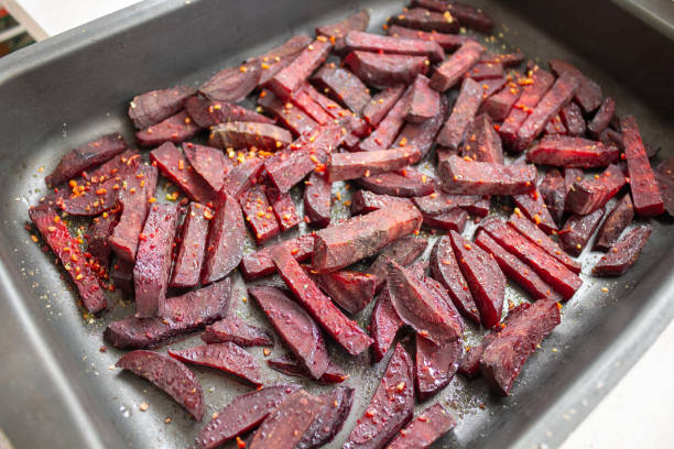 Juicy beetroot slices baked in the oven on a Teflon-coated baking sheet. High quality photo