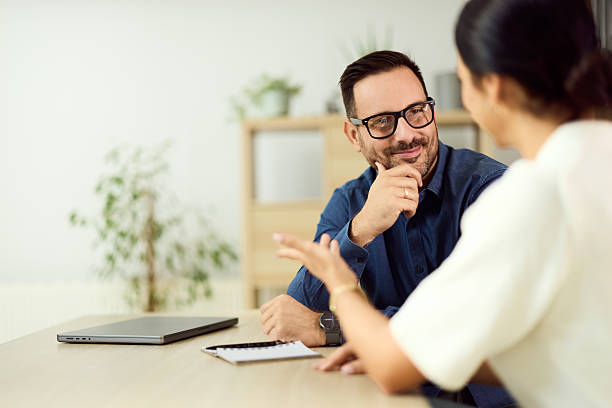 istock Professional Business Discussion Between Two Colleagues in an Office Setting 2204502872