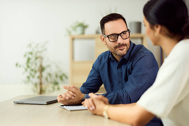 istock Business Discussion Between Two Colleagues in a Modern Office Setting 2204502877