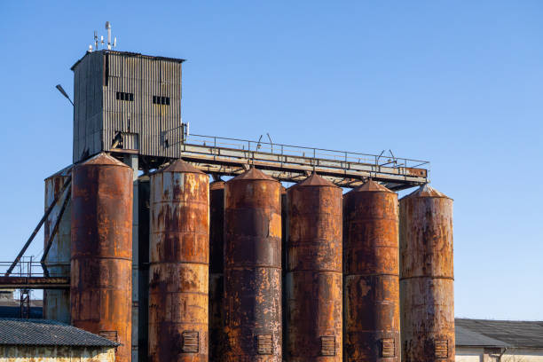 istock old dilapidated grain elevator in the countryside. rusty and abandoned grain elevator against the blue sky. 2204503069