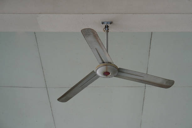istock old and dirty Ceiling fan mounted on white cement floor background, object, technology, ancient, antique, decor, copy space 2204503087