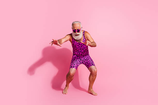Full size photo of glamour senior man dance enjoy discotheque wear leopard print swimsuit isolated pink color background Full size photo of glamour senior man dance enjoy discotheque wear leopard print swimsuit isolated pink color background. gay man men sunglasses party stock pictures, royalty-free photos & images