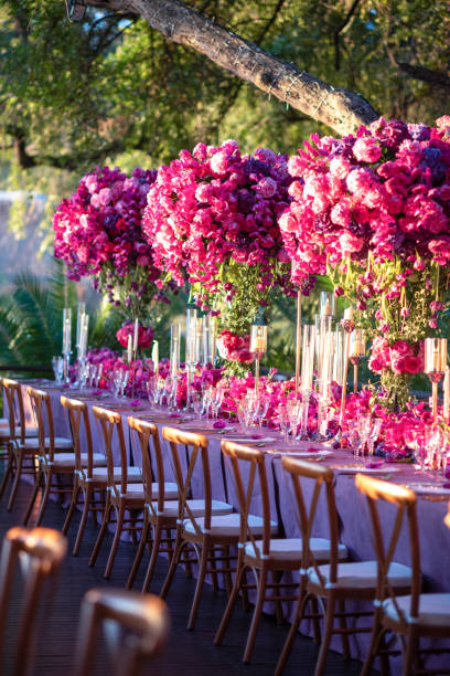 istock Luxurious Floral Table Setting with Vibrant Pink and Purple Blooms 2204503415