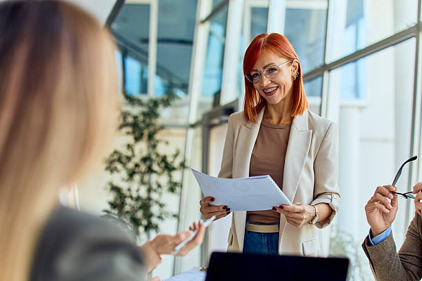 istock Friendly Businesswoman Leading Interactive Meeting in Modern Office Environment 2204505388
