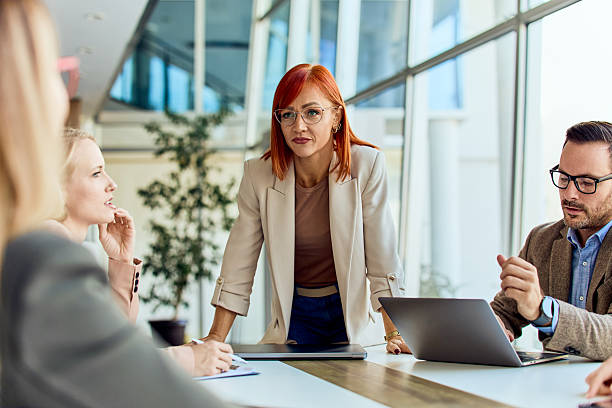 istock Business Meeting with Professional Team Discussing Ideas in a Modern Office 2204505391