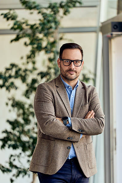 istock Confident Professional Man in Office Setting with Modern and Stylish Attire 2204505394