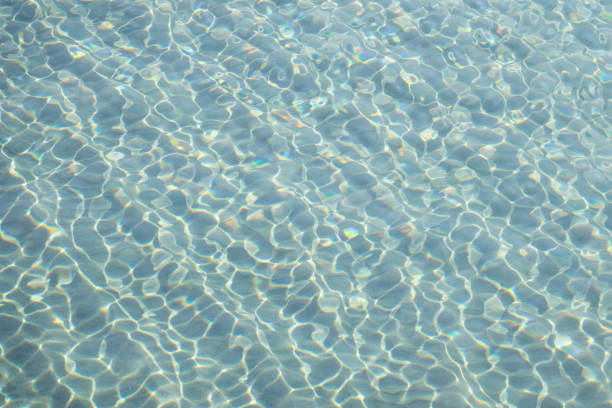 ripples from small waves on the surface of the water