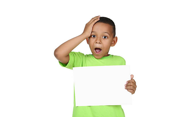 istock Cute american boy with blank board on white background 2204507094