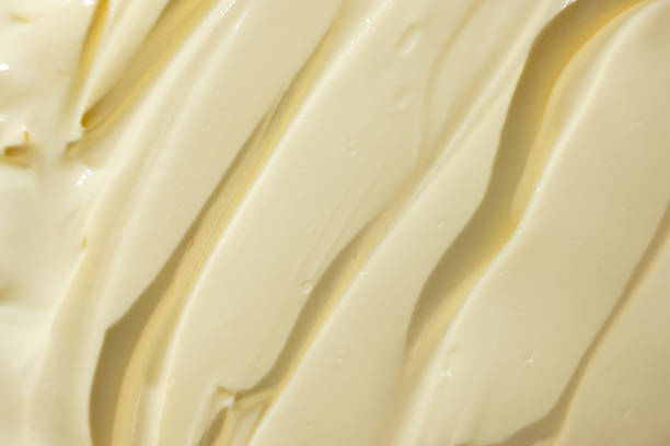 istock Glossy White Mayonnaise Surface. Food Texture Background 2204509363
