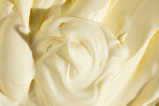 istock Abstract Food Background. Swirled Mayonnaise Spread 2204509372