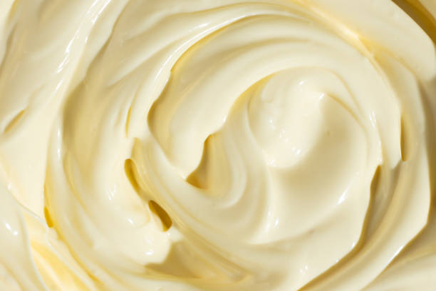 istock Abstract Food Background. Swirled Mayonnaise Spread 2204509387
