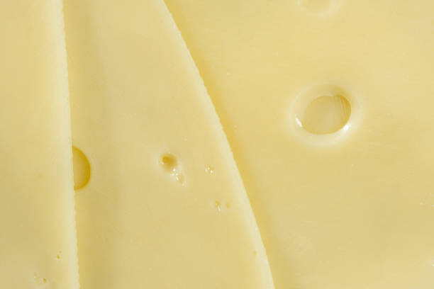 istock Delicate Semi-Hard Cheese Slices with Holes 2204509390