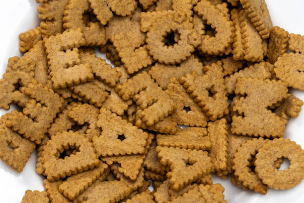 istock Whole grain cereal biscuits filling a bowl, ready for breakfast 2204512526