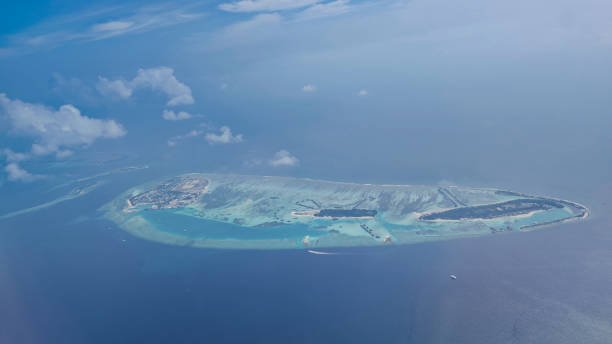 istock an island in the Maldives seen from the plane 2204515009
