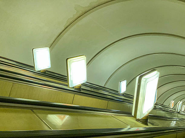 istock A moving subway train interior photo, captured from inside with a sense of motion and depth, reflecting off tunnel walls Natural light enters through white-framed windows, illuminated by fluorescent 2204516728