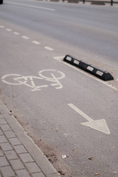 istock A dedicated bicycle lane with a clear road marking and directional arrow, emphasizing urban cycling infrastructure and sustainable transportation 2204517384