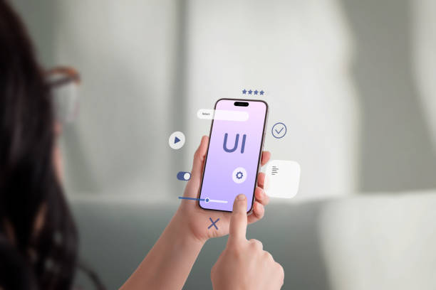 istock Young woman interacting with smartphone, floating UI elements, user experience and mobile app development concept 2204517512