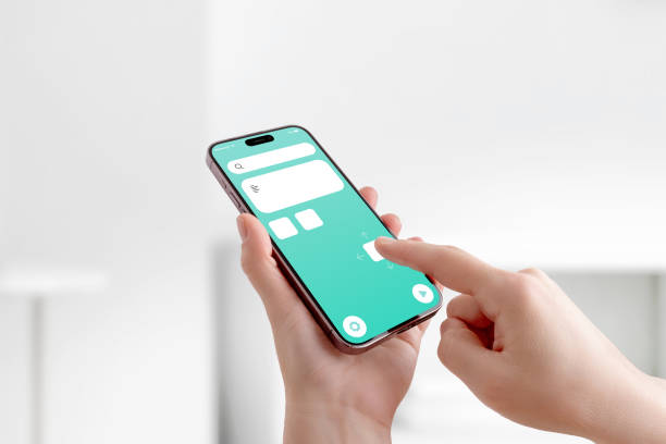 istock Finger dragging icons and UI elements on smartphone screen, concept of mobile app customization and interface development 2204517522