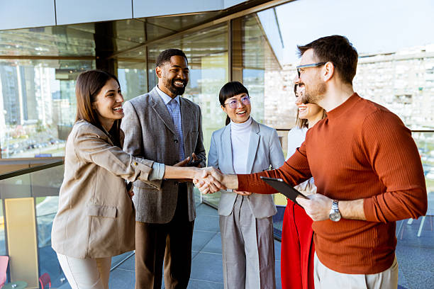 istock Networking and collaboration flourishes during a business meeting in a modern office setting 2204521269